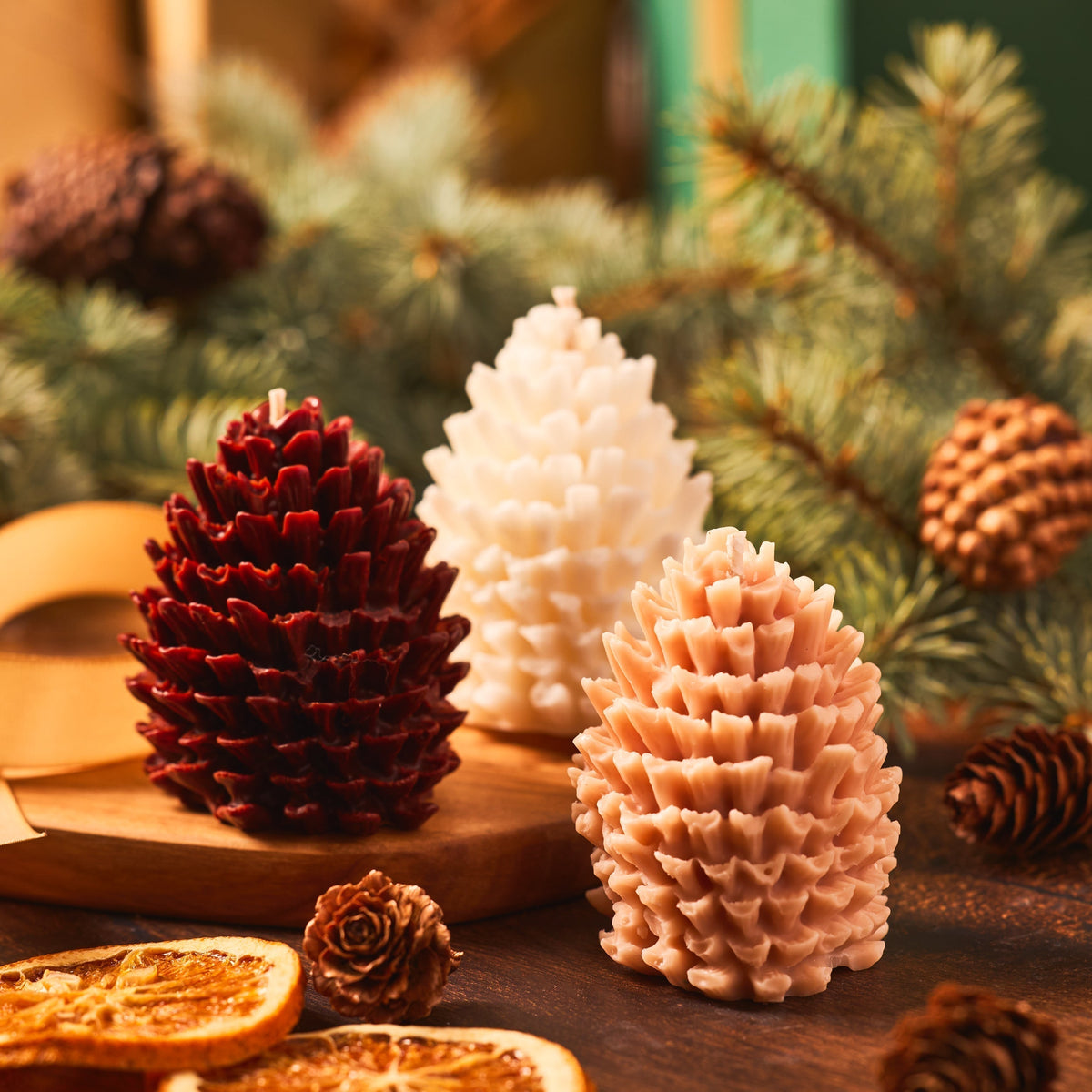 pinecone candles in front of a tree